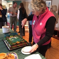 Sue Andrews cuts the cake