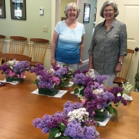 Sue and Laurie arranging flowers for the Sargent Room