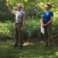 John Garvey and Cotton Cleveland share information about their Wayne's Woods protected property in Goshen.