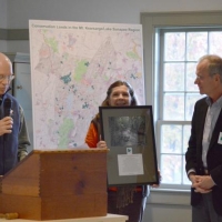 Doug Lyon and Debbie Stanley thank John Garvey at the Annual Meeting for his past service to Ausbon Sargent